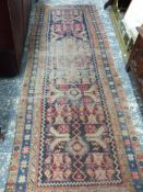 AN ANTIQUE PERSIAN HAMADAN RUNNER, 300 x 102cm