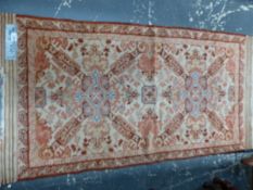 AN ANTIQUE ORIENTAL RUG OF CAUCASIAN DESIGN, 155 x 80cm