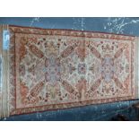 AN ANTIQUE ORIENTAL RUG OF CAUCASIAN DESIGN, 155 x 80cm