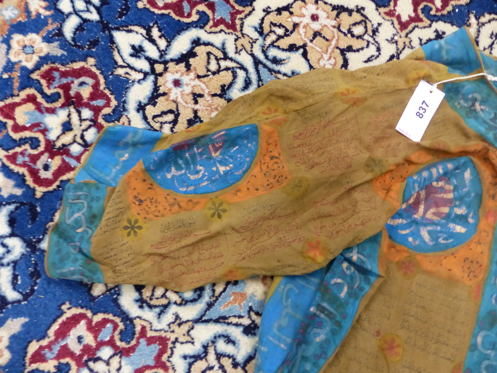 AN ISLAMIC TALISMANIC BROWN TUNIC PAINTED WITH BLUE EDGING AND ORANGE DETAILS ABOUT INSCRIPTIONS - Image 2 of 8