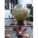 AN EARLY 20th.C. "GEOGRAPHIA" 10" TERRESTRIAL GLOBE WITH GILT BRASS SCALE ON STAINED WOOD STAND.