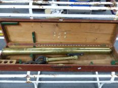 A MAHOGANY CASED BRASS SINGLE DRAW TELESCOPE WITH 7cms. LENS AND WITH ATTACHED TRIPOD, THE BARREL