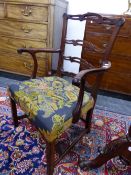 A GEORGE III MAHOGANY TRIPLE PIERCED LADDER BACKED ELBOW CHAIR, THE FLORAL NEEDLE WORKED SEAT