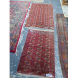 TWO TEKKE BOKHARA RUGS, 192 x 113cms AND 144 x 91cms (2)