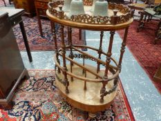 A VICTORIAN WALNUT OVAL TABLE TOPPED CANTERBURY, THE PIERCED GALLEY TO THE TOP REPEATED CENTRALLY TO