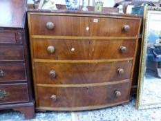 A VICTORIAN MAHOGANY BOW FRONT CHEST OF DRAWERS.