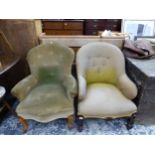 TWO SIMILAR VICTORIAN BUTTON BACK ARM CHAIRS ON CARVED FORE LEGS.