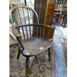 A 19th C. OAK CHILD'S STICK BACKED WINDSOR CHAIR WITH SADDLE SEAT AND BALUSTER TURNED FRONT LEGS