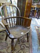 A 19th C. OAK CHILD'S STICK BACKED WINDSOR CHAIR WITH SADDLE SEAT AND BALUSTER TURNED FRONT LEGS