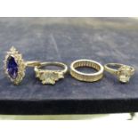 FOUR SILVER AND CUBIC ZIRCONIA DRESS RINGS