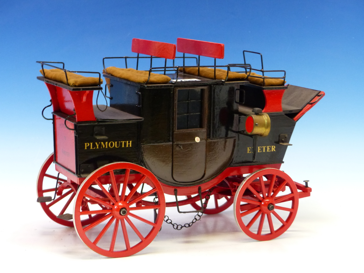 A SCALE MODEL OF A SIGN WRITTEN PLYMOUTH, EXETER CARRIAGE. APPROX LENGTH 35cms.