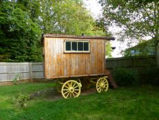 AN IMPRESSIVE "ROMANY" WAGON, BUILT ON A PERIOD CART CHASSIS AND WHEELS, WOOD CONSTRUCTION