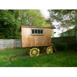 AN IMPRESSIVE "ROMANY" WAGON, BUILT ON A PERIOD CART CHASSIS AND WHEELS, WOOD CONSTRUCTION