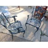 A PAIR OF CAST METAL GARDEN CHAIRS