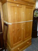 A LARGE ANTIQUE PINE TWO DOOR WARDROBE.