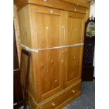 A LARGE ANTIQUE PINE TWO DOOR WARDROBE.