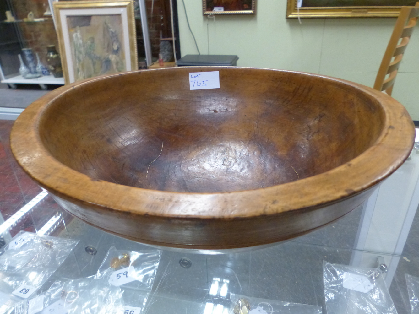 A TURNED WOOD DAIRY BOWL. Dia. 32cms.