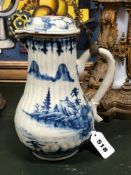 AN 18th C. CHINESE BLUE AND WHITE RIBBED BALUSTER JUG AND COVER PAINTED WITH PAGODAS AND PAVILIONS O