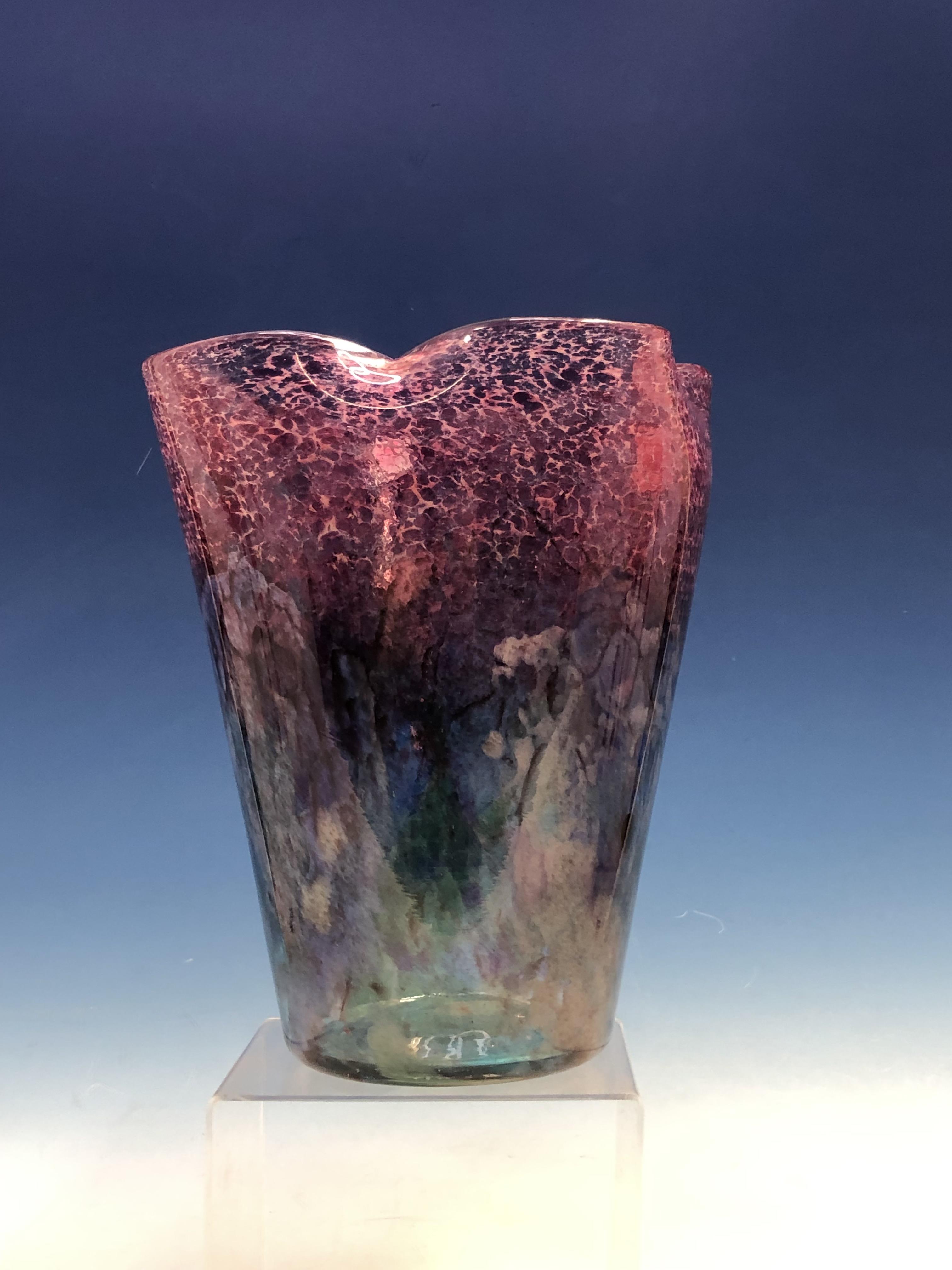 A MONART GLASS VASE, THE QUATREFOIL RIM DAPPLED PINK, THE SIDES TAPERING TO A CIRCULAR FOOT