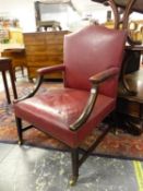 A GEORGE III MAHOGANY GAINSBOROUGH CHAIR CLOSE NAIL UPHOLSTERED IN RED LEATHER, THE SQUARE SECTIONED