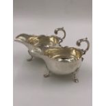 A PAIR OF VICTORIAN HALLMARKED SILVER SAUCE BOATS DATED 1898 LONDON FOR HENRY STRATFORD. WEIGHT