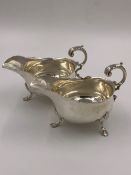 A PAIR OF VICTORIAN HALLMARKED SILVER SAUCE BOATS DATED 1898 LONDON FOR HENRY STRATFORD. WEIGHT