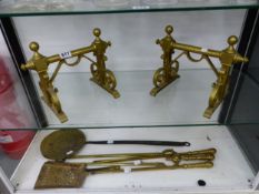 A PAIR OF BRASS FIRE DOGS, BRASS FIRE TOOLS, ETC.