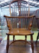 AN ANTIQUE WINDSOR CHAIR WITH TRIPLE PIERCED SPLAT FLANKED BY THREE STICKS, THE SADDLE SEAT ABOVE A