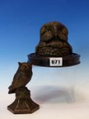 TWO BRONZED SPELTER OWL INKWELLS BOTH WITH GLASS EYES, THE LARGER A HEAD ONLY MOUNTED ON AN EBONISED