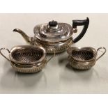 A HALLMARKED SILVER THREE PART TEASET COMPRISING OF A TEAPOT, SUGAR BOWL AND CREAMER DATED 1936