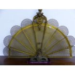 A 19th C. BRASS FAN FIRE GUARD, THE PIERCED LEAVES FANNING OUT BELOW A FOLIATE BALUSTER