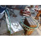 WROUGHT IRON GARDEN TABLE AND THREE MATCHING CHAIRS AND A WOODEN CRATE