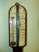 T & C LAKE TAUNTON, A ROSEWOOD STICK BAROMETER, THE IVORY SCALE FLANKED BY A MERCURY THERMOMETER,