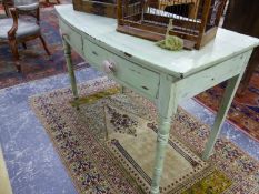 A 19th C. GREEN PAINTED TWO DRAWER SIDE TABLE, THE BOW FRONTED TOP WITH A PINK LINE, THE TURNED