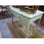 A 19th C. GREEN PAINTED TWO DRAWER SIDE TABLE, THE BOW FRONTED TOP WITH A PINK LINE, THE TURNED