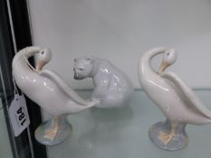 A LLADRO POLAR BEAR AND TWO LLADRO SWANS