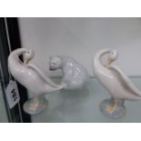 A LLADRO POLAR BEAR AND TWO LLADRO SWANS