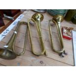 THREE BRASS TRUMPETS AND A BOX OF MOUTH PIECES