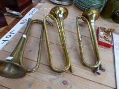 THREE BRASS TRUMPETS AND A BOX OF MOUTH PIECES