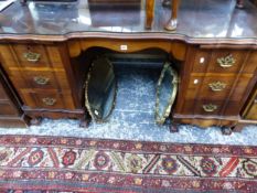 A LARGE HARDWOOD TWIN PEDESTAL DESK ON CLAW AND BALL FEET.