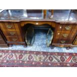 A LARGE HARDWOOD TWIN PEDESTAL DESK ON CLAW AND BALL FEET.