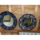 TWO DECORATIVE POLYCHROME POTTERY CIRCULAR MIRRORS. LARGEST D. 48cms (2)