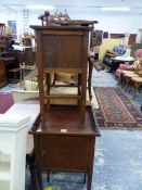 AN ANTIQUE MAHOGANY BEDSIDE CABINET AND A SEWING BOX.