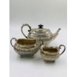 A VICTORIAN SILVER HALLMARKED TEAPOT, SUGAR BOWL AND CREAMER FOR JAMES DIXON AND SONS LTD, DATED