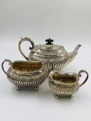 A VICTORIAN SILVER HALLMARKED TEAPOT, SUGAR BOWL AND CREAMER FOR JAMES DIXON AND SONS LTD, DATED