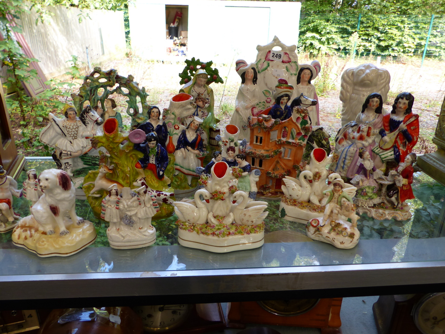 A LARGE QUANTITY OF STAFFORDSHIRE FLAT BACK FIGURINE GROUPS