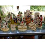 A LARGE QUANTITY OF STAFFORDSHIRE FLAT BACK FIGURINE GROUPS