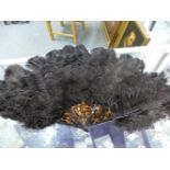 A DUVELLEROY BOXED BLACK OSTRICH FEATHER FAN WITH IMITATION TORTOISESHELL STICKS