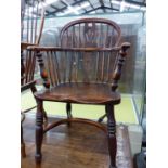 AN ANTIQUE WINDSOR CHAIR WITH TRIPLE PIERCED SPLAT FLANKED BY THREE STICKS, THE SADDLE SEAT ABOVE BA