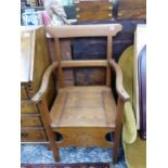 A 19TH CENTURY LARGE PINE ARM CHAIR.